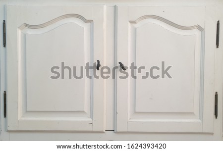 closeup white wooden cupboard door