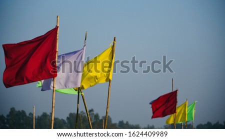 Colourful flags tied with bamboo object unique photo