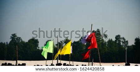 Colourful flags flying around a place