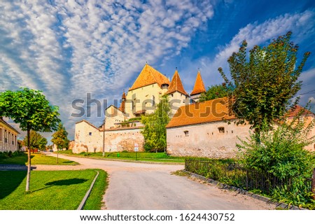 Scenic view of Lutheran fortified church in Biertan, Transylvania, Romania. Picturesque clouds. It was built by the Transylvanian Saxon community. UNESCO World Heritage Site