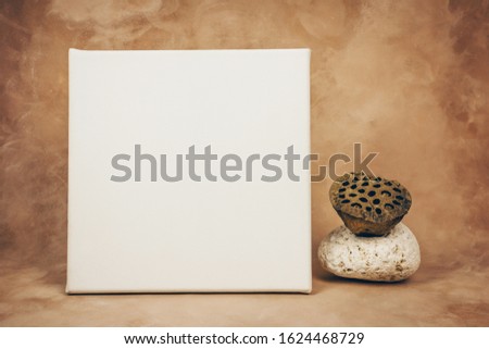 White canvas board in interior. Blank space for art picture or photo. Canvas printing concept. Mockup poster.