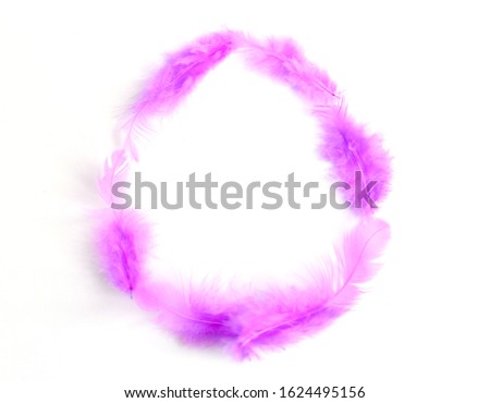 Purple feathers in the shape of an Easter egg, creative minimalist Easter background
