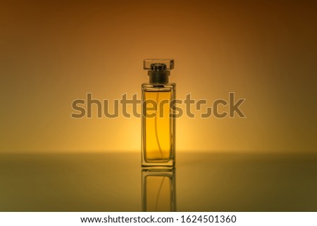 Perfume bottle on a colored background