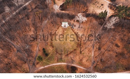 Small old building in the park, autumn, aerial photography.