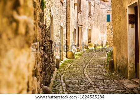 Italy, Sicily, Trapani Province, Erice. Narrow cobblestone streets in the ancient hill town of Erice. Royalty-Free Stock Photo #1624535284