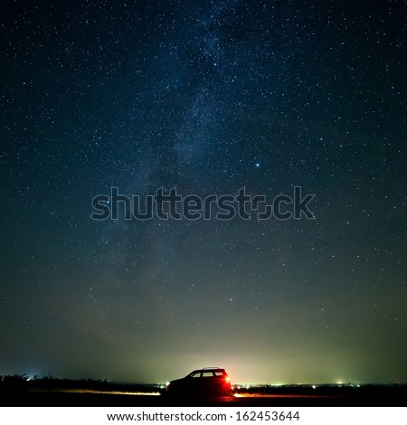The car of the tourist against the star sky.