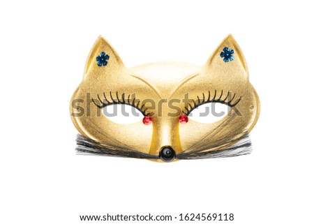 Golden fancy cat carnival mask with red beads and moustache isolated on a white background	