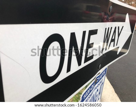 One Way Traffic Sign White and Black with Arrow