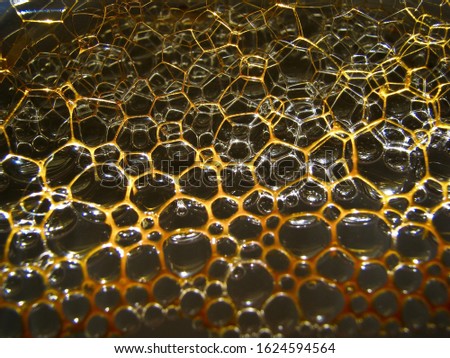 close up of dirty dish water bubbles
