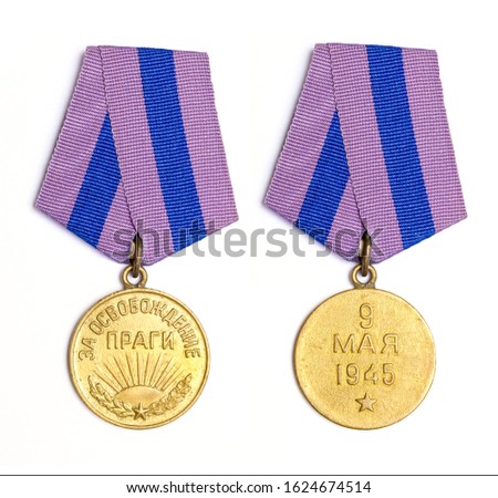 Soviet medal "For the liberation of Prague" in white background. The inscription on the medal is translated: For the defense of Prague. May 9, 1945