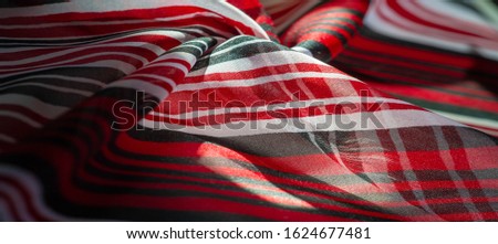 Background texture. multicolored striped silk fabric. Mexican coloring theme bright colored striped pattern with abstract stripes