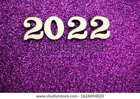 Happy New year 2022 with space copy on purple glitter background