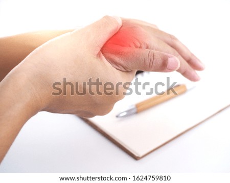 Young Asian working woman suffering hand pain, trigger finger and massage on painful wrist. medical symptom and healthcare concept.