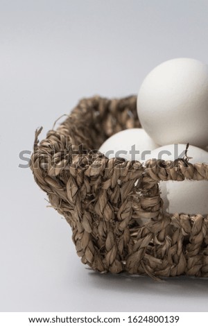 Close-up view of raw eggs in egg box on white background