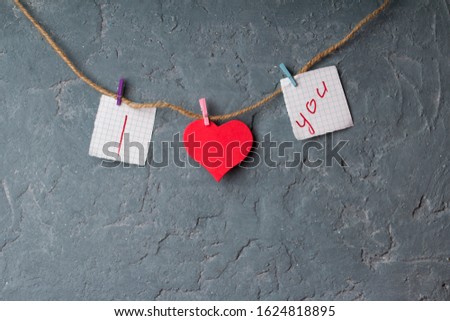 inscription I Love you with red  heart on the concrete wall