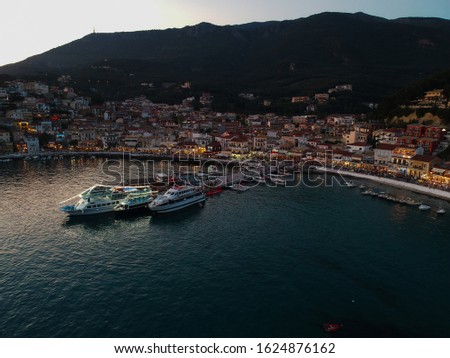 Parga Greece aerial view of the town port and speedboats tropical and exotic historical castle of parga town Greece epirus preveza the famous tourist attractions Drone photo aerial photo 