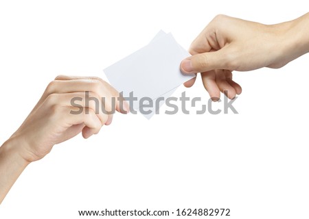 Hands sharing two blank sheets of paper (tickets, flyers, invitations, coupons, money, etc.), isolated on white background