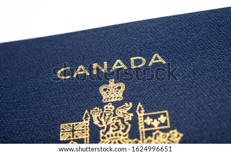 Close up view of a canadian passport, emigration banner.