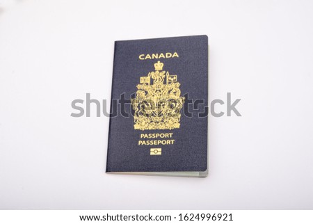 Close up view of a canadian passport, emigration banner