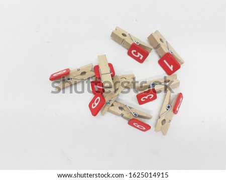 Modern Classic Retro Vintage Natural Wooden Clip with Printed Red Numbers for Accessories in White Isolated Background