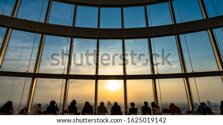 People silhouette inside Observation Deck. Tokyo, Japan.