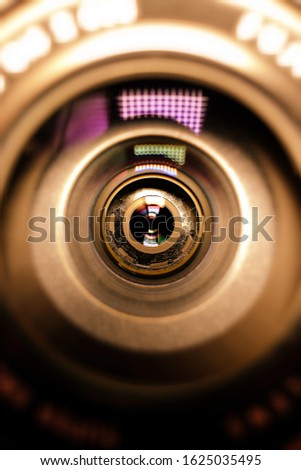 The photographer's business card.Camera lens in the background for conceptual design. Dark background. Technological concept. Business concept