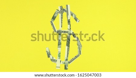 Dollar sign symbol made from american dollars business and finance concept.