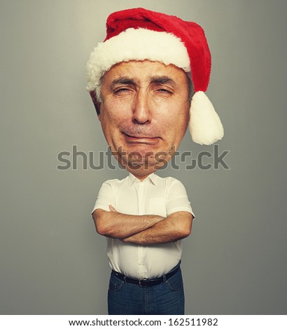 funny picture of unhappy senior man in red santa hat