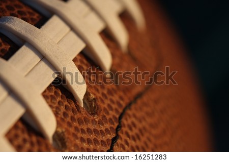 Close up of football laces faded to black