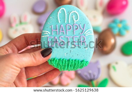 Happy Easter. Multicolored pastel easter cookies on a white background. Easter concept