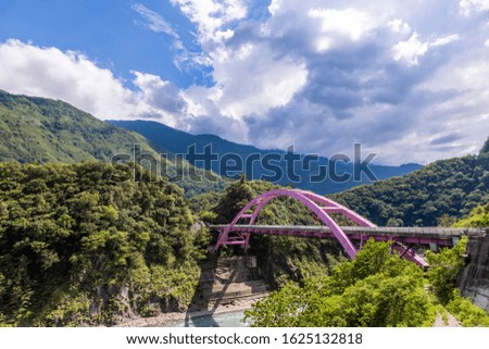 Panoramic picture on the Pink Arch Bridge in the mountains of Taiwan in summer