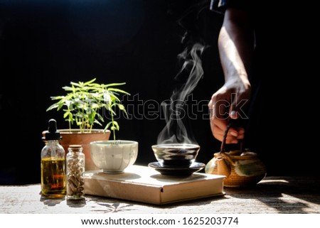Cannabis capsules, hemp oil, hemp seed extract, along with hot hemp tea for medical use Royalty-Free Stock Photo #1625203774