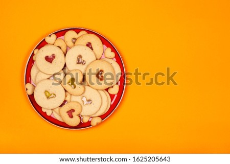 A plate with cookies in the shape of hearts. Concept of the Valentine's Day, surprises with love, holiday, etc. Trend colors, flat lay, copy space.