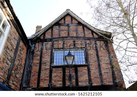 Old typical English house made of brick and wood