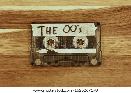 Vintage audio cassette tape with the description: THE 00's Royalty-Free Stock Photo #1625267170