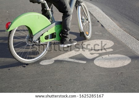 Cyclist on Bike Path, Paris; France