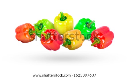 Multi-colored peppers from red to green isolated on a white background.
