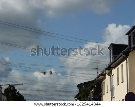many cables hang in the blue sky