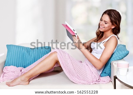 Beautiful young woman relaxing on the couch