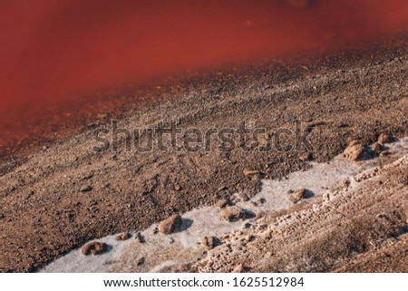 Masazirgo or Masazir Lake is a salty lake near of Baku, Azerbaijan. Water in lake is pink because have large volumes of chloride and sulphate are concentrated in ion composition  Royalty-Free Stock Photo #1625512984