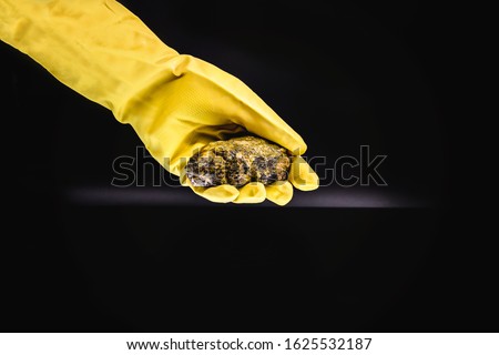 production of enriched uranium. Uranium ore found in nature. Yellow and radioactive stone. Risk of radiation. Royalty-Free Stock Photo #1625532187