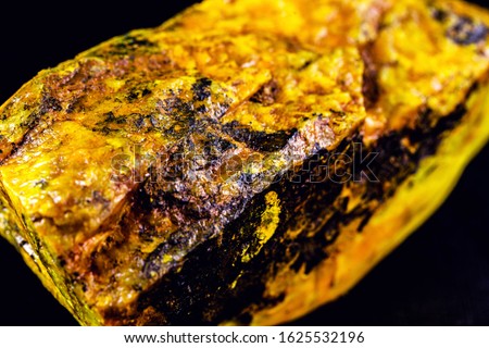 production of enriched uranium. Uranium ore found in nature. Yellow and radioactive stone. Risk of radiation. Royalty-Free Stock Photo #1625532196