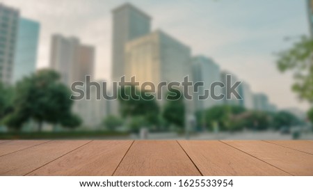 Empty Wood Plate Top Table On Blur Street And City For Use As Background