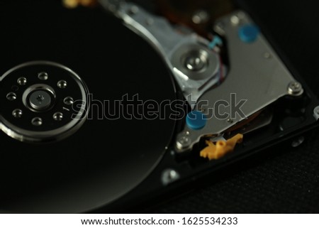 The internal hard disk (SATA) photography with black background and single light technique . 