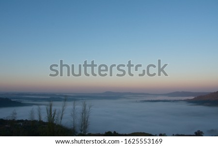 The landscape of mountains covered with fog in the early morning, the morning in  Thailand