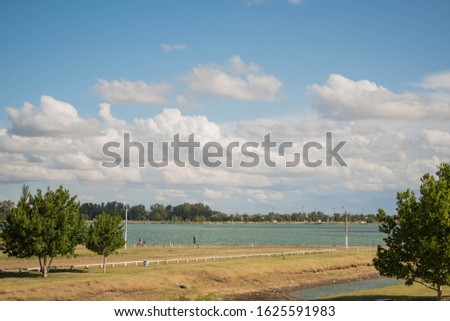 Rural landscape over sky with clouds