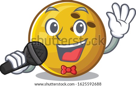 Happy bowling ball singing on a microphone
