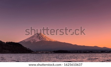 Last light on Mount Fuji and Lake Kawaguchi during early spring season at Lake Kawaguchi, Fujikawaguchiko, Minamitsuru District, Yamanashi Prefecture, Japan.