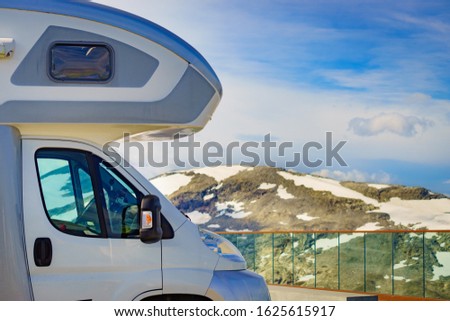 Camper car on Dalsnibba viewpoint against mountains landscape, Norway. Travel, adventure in motor home. Royalty-Free Stock Photo #1625615917