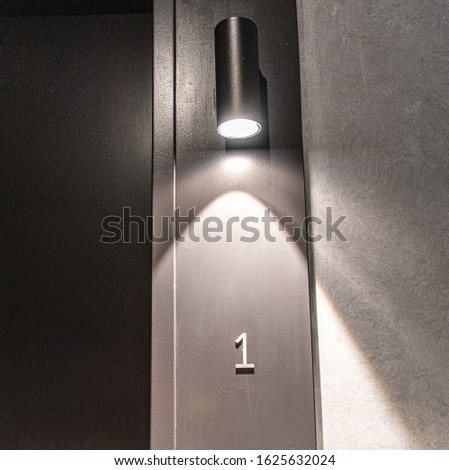 door number 1 under a  mysterious light